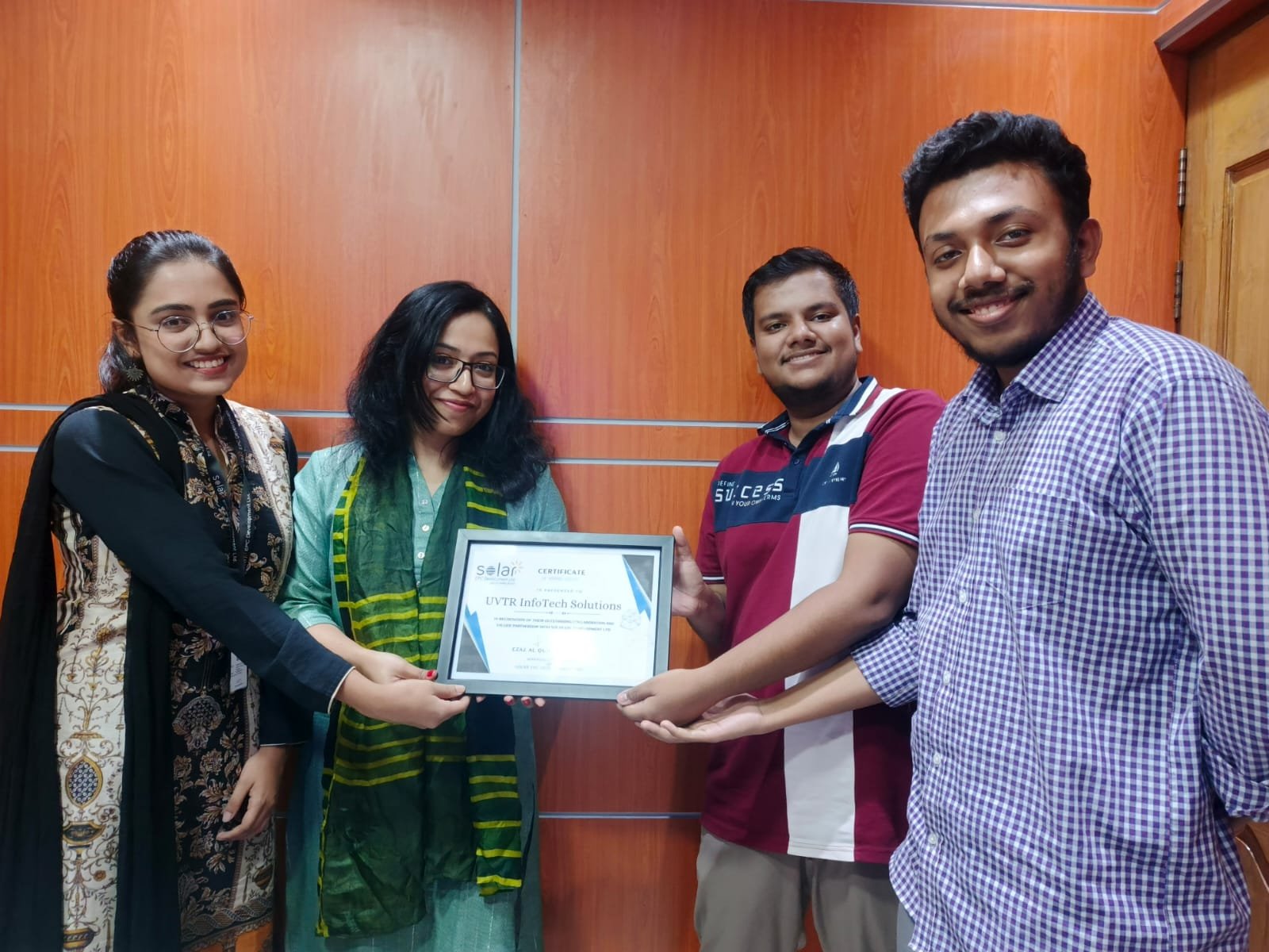 UVTR InfoTech Solutions team receiving certificate from Solar EPC Development